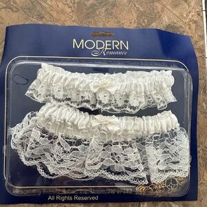 New in package 
2-piece White silk/lace stretchy wedding garter set for Bride